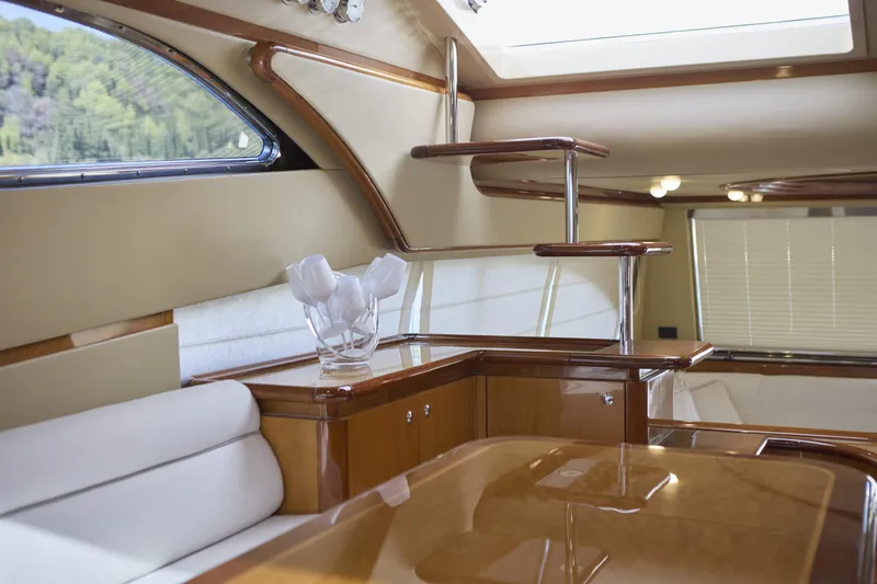  Yacht Photos Pics Luxurious interior of 2004 Ferretti Yachts 680, featuring elegant wood finishes and modern design.
