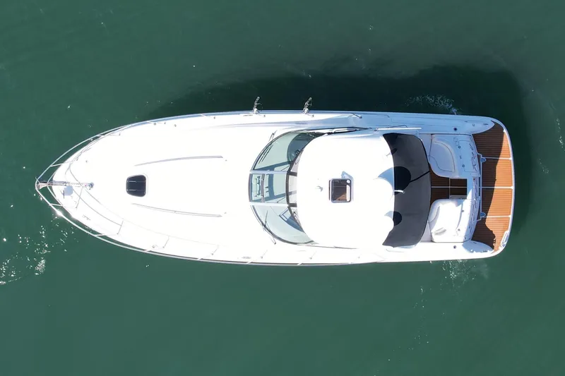 Knock On Wood Yacht Photos Pics Aerial view of 2008 Sea Ray 38 Sundancer yacht on calm water.