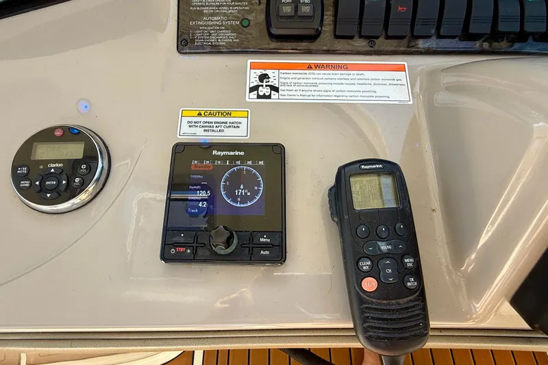 Knock On Wood Yacht Photos Pics Control panel of a 2008 Sea Ray 38 Sundancer with navigation and communication devices.