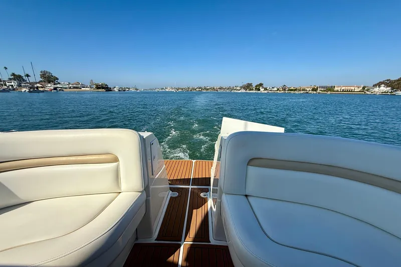 Knock On Wood Yacht Photos Pics 2008 Sea Ray 38 Sundancer cruising on a sunny day, featuring luxurious seating and scenic water views.