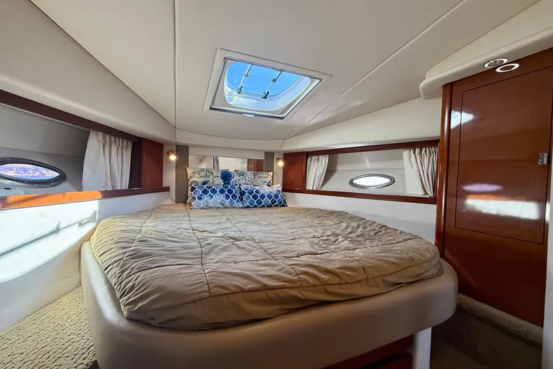 Knock On Wood Yacht Photos Pics Luxurious cabin interior of 2008 Sea Ray 38 Sundancer yacht with skylight and cozy bedding.