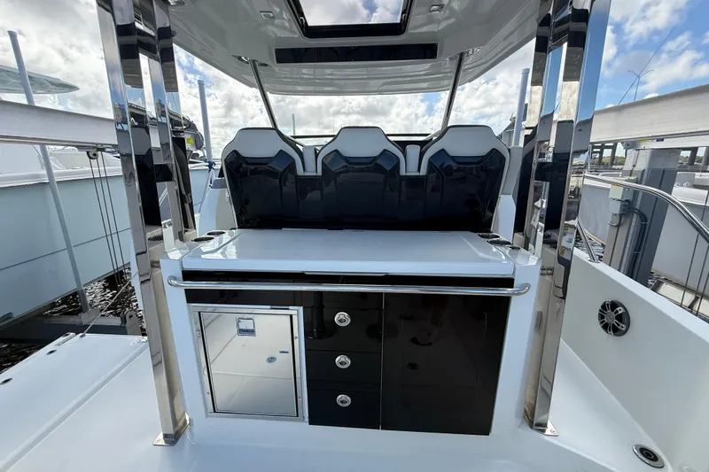  Yacht Photos Pics 2022 Jeanneau Leader 10.5 WA Series 2 boat interior with seating and storage.