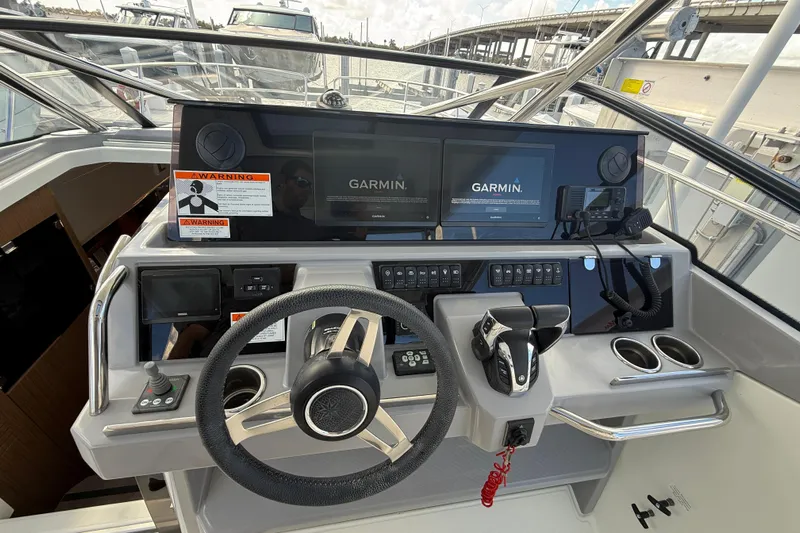  Yacht Photos Pics 2022 Jeanneau Leader 10.5 WA Series 2 helm with Garmin navigation displays.
