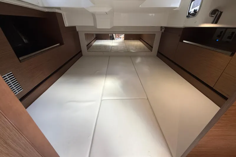  Yacht Photos Pics Interior cabin of 2022 Jeanneau Leader 10.5 WA Series 2, featuring sleek wood finishes.