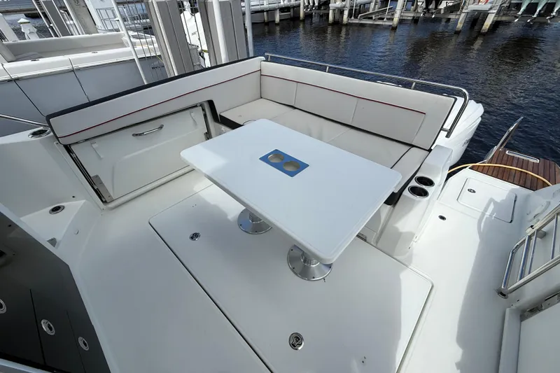  Yacht Photos Pics 2022 Jeanneau Leader 10.5 WA Series 2 boat deck with seating and table.