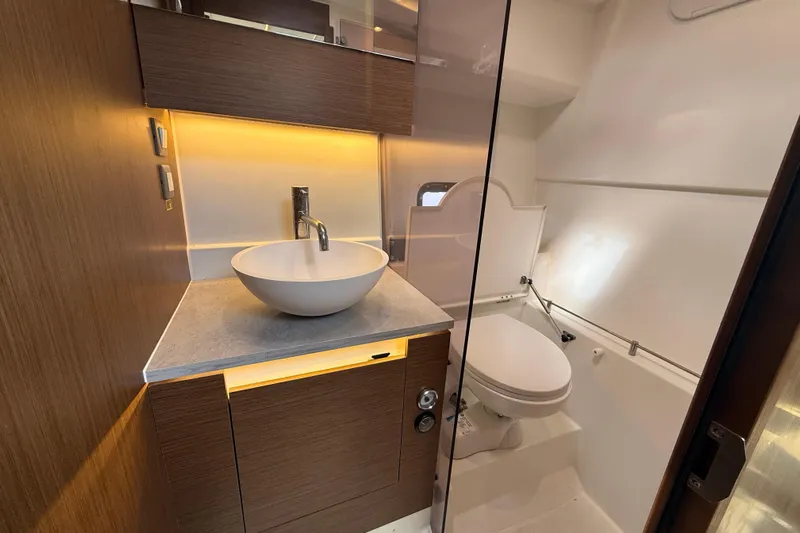  Yacht Photos Pics 2022 Jeanneau Leader 10.5 WA Series 2 bathroom with modern sink and toilet.