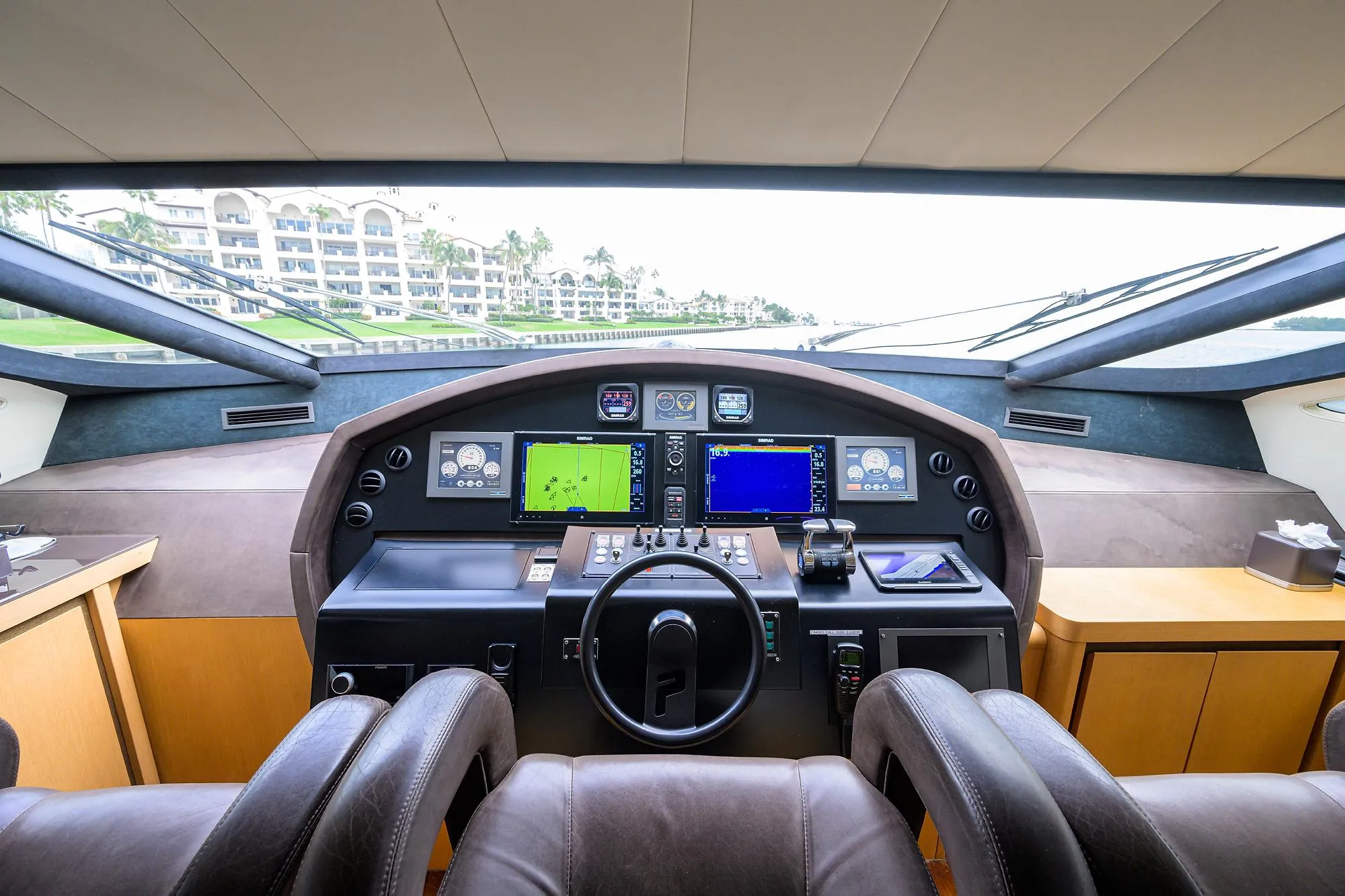 2009 Pershing 90 Express yacht cockpit with advanced navigation systems and luxurious seating.