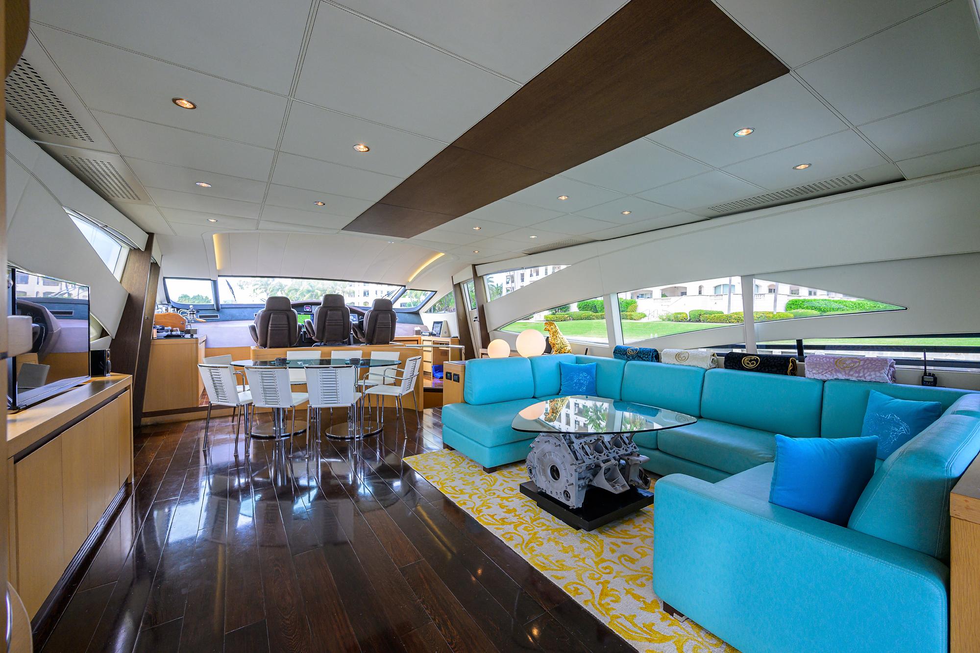 Luxurious interior of 2009 Pershing 90 Express yacht with modern seating and elegant decor.