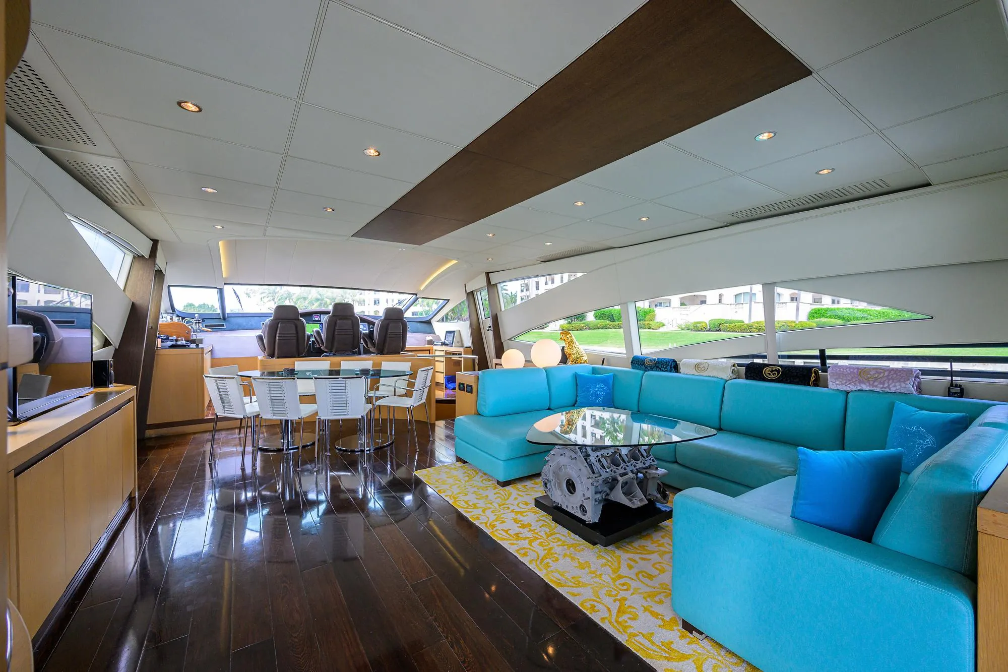 Luxurious interior of 2009 Pershing 90 Express yacht with modern seating and elegant decor.