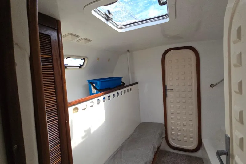  Yacht Photos Pics Cozy interior of 2018 Custom Len Jenkins 50 boat with skylight and storage.