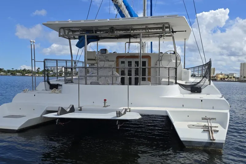  Yacht Photos Pics Custom Len Jenkins 50 catamaran, 2018 model, docked on a sunny day with blue skies.