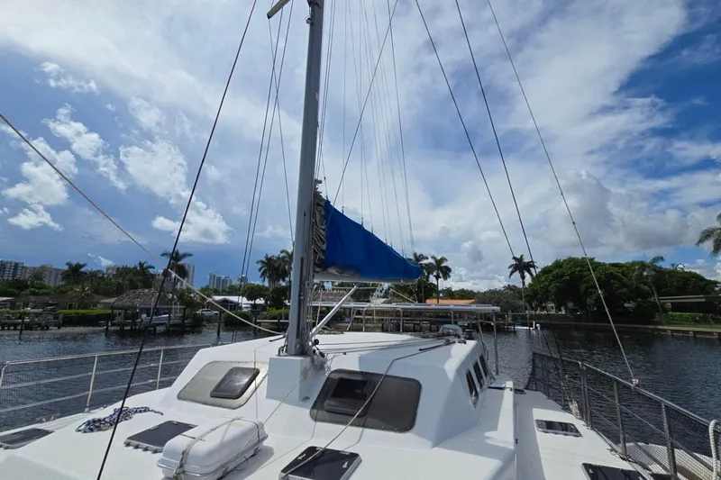  Yacht Photos Pics Sailboat "Len Jenkins 50" docked, blue sky, palm trees, waterfront view.