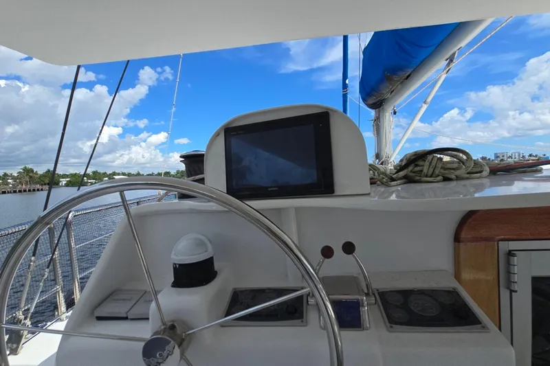  Yacht Photos Pics Cockpit of 2018 Custom Len Jenkins 50 sailboat with steering wheel and navigation equipment.