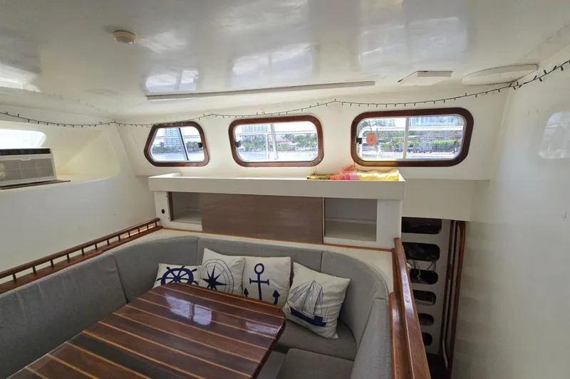  Yacht Photos Pics Interior of 2018 Custom Len Jenkins 50 yacht with cozy seating and nautical decor.