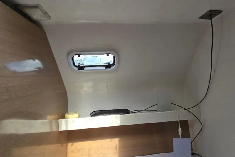  Yacht Photos Pics Interior of 2018 Custom Len Jenkins 50 boat with small window and shelf.