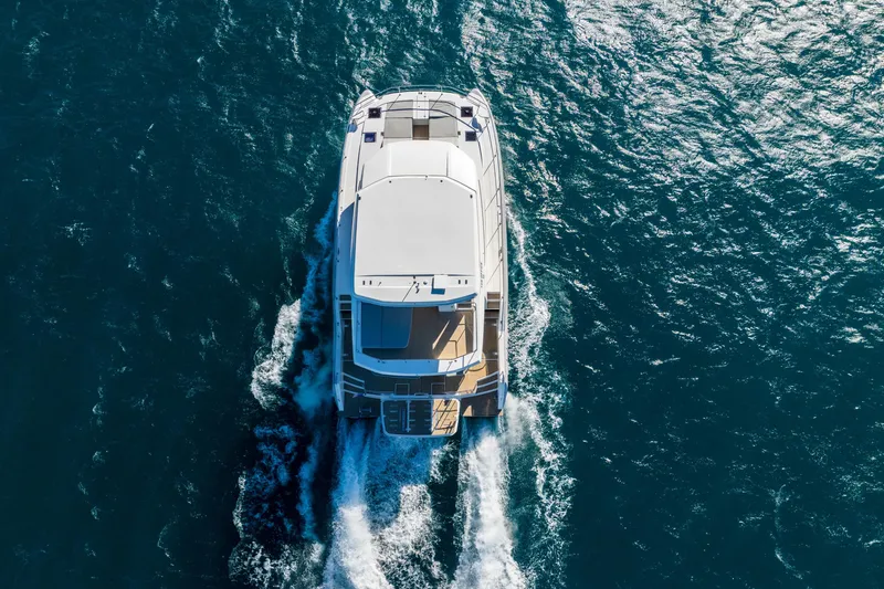 The Office Yacht Photos Pics Aerial view of 2021 Leopard 53 Powercat cruising on open water.