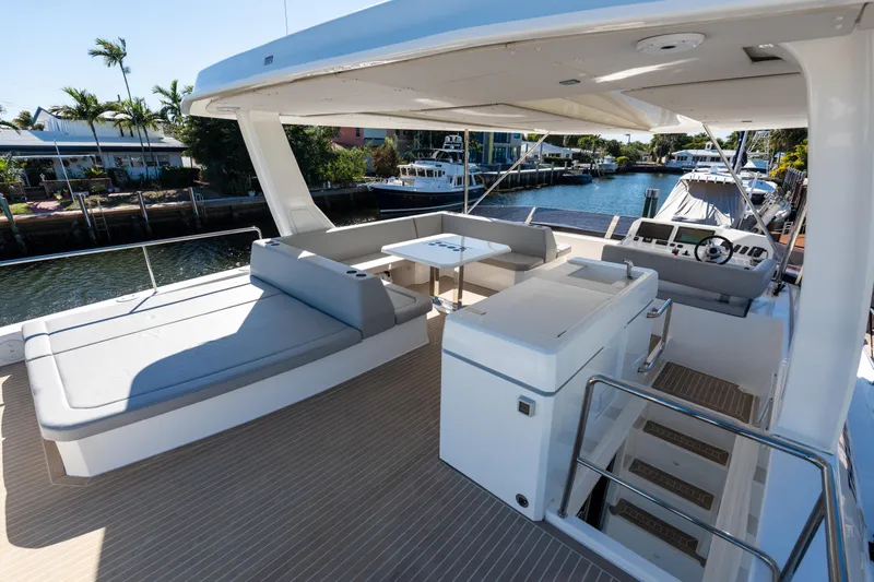 The Office Yacht Photos Pics Luxurious 2021 Leopard 53 Powercat yacht with spacious deck and modern seating area.