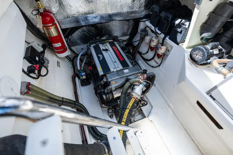 The Office Yacht Photos Pics Engine room of 2021 Leopard 53 Powercat with Yanmar engine and fire extinguisher.