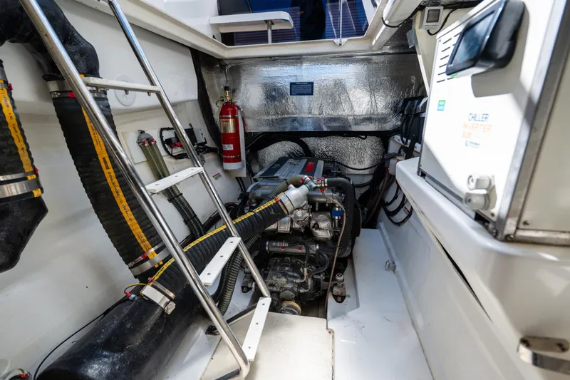 The Office Yacht Photos Pics Engine room of 2021 Leopard 53 Powercat with visible machinery and fire extinguisher.