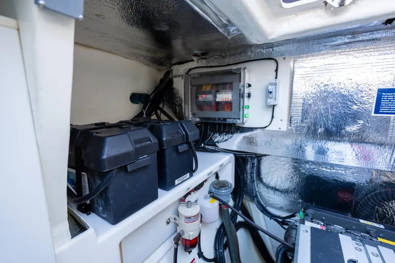 The Office Yacht Photos Pics Engine room of 2021 Leopard 53 Powercat with batteries and electrical components.