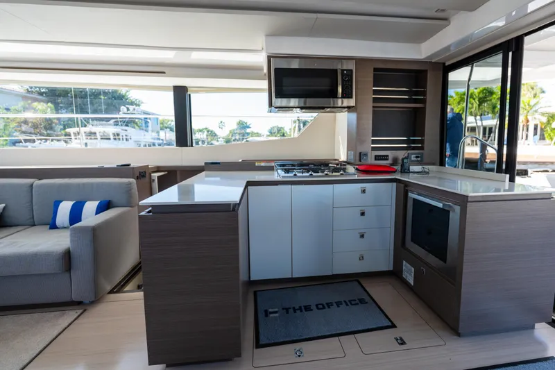 The Office Yacht Photos Pics Modern kitchen interior on 2021 Leopard 53 Powercat yacht, featuring sleek design and appliances.
