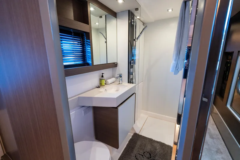 The Office Yacht Photos Pics Modern bathroom in 2021 Leopard 53 Powercat yacht, featuring sleek design and amenities.