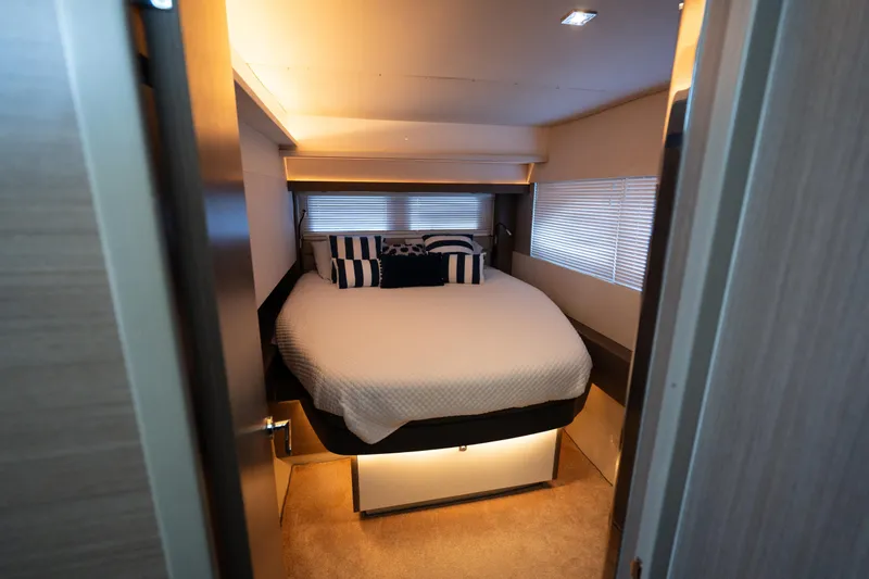 The Office Yacht Photos Pics Luxurious bedroom interior of 2021 Leopard 53 Powercat yacht with cozy bedding.