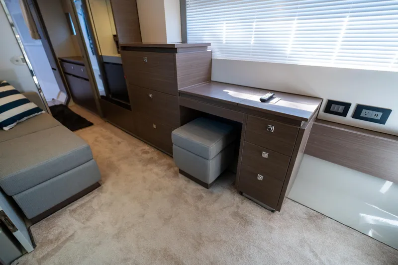 The Office Yacht Photos Pics Interior of 2021 Leopard 53 Powercat with modern wood cabinetry and seating.