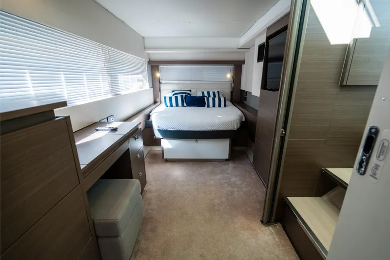 The Office Yacht Photos Pics Luxurious bedroom interior of 2021 Leopard 53 Powercat yacht with modern furnishings.