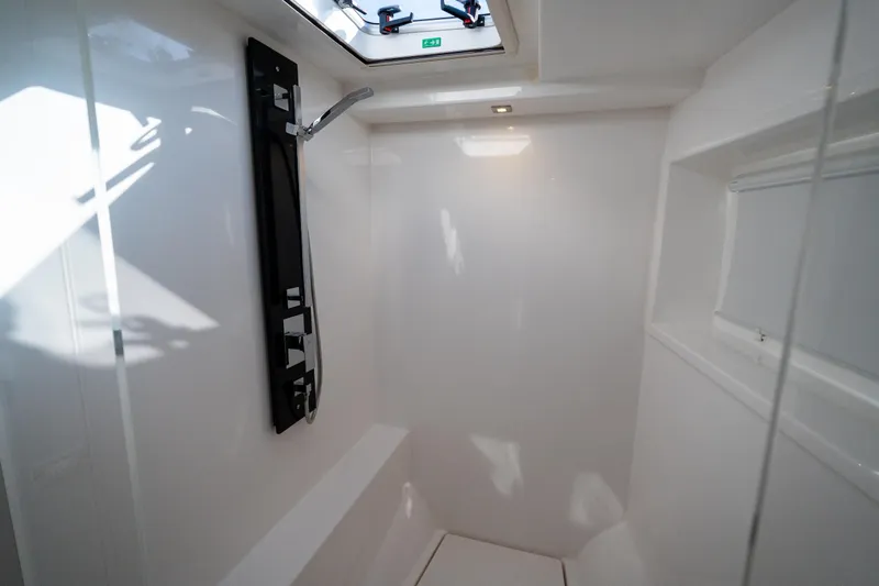 The Office Yacht Photos Pics Modern shower area in 2021 Leopard 53 Powercat yacht, featuring sleek design and overhead lighting.