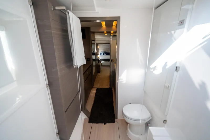 The Office Yacht Photos Pics Interior of 2021 Leopard 53 Powercat yacht bathroom with modern design and amenities.