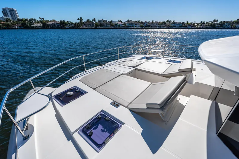The Office Yacht Photos Pics Luxurious 2021 Leopard 53 Powercat yacht with spacious deck and scenic waterfront view.