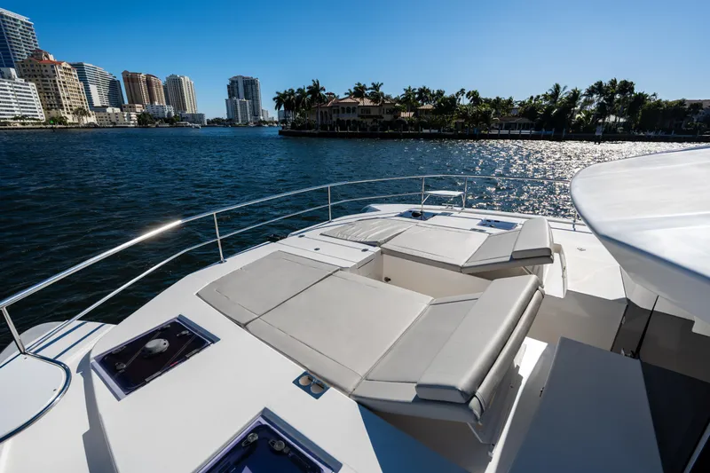 The Office Yacht Photos Pics Leopard 53 Powercat 2021 yacht with sun loungers, city skyline, and waterfront view.