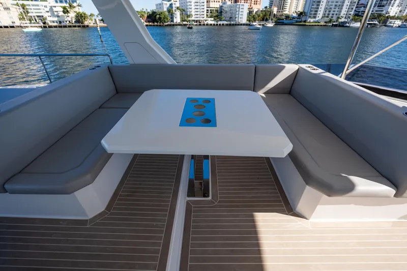 The Office Yacht Photos Pics Luxurious seating area on 2021 Leopard 53 Powercat yacht with waterfront view.
