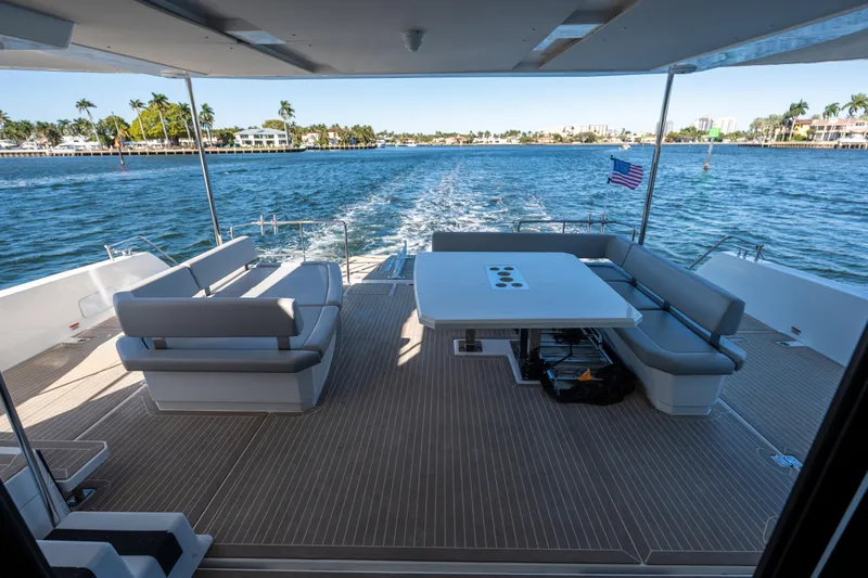 The Office Yacht Photos Pics Spacious deck of 2021 Leopard 53 Powercat yacht with seating and ocean view.
