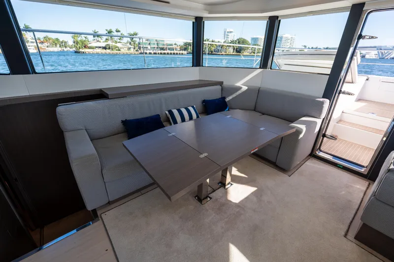 The Office Yacht Photos Pics Interior of 2021 Leopard 53 Powercat with modern seating and ocean view.