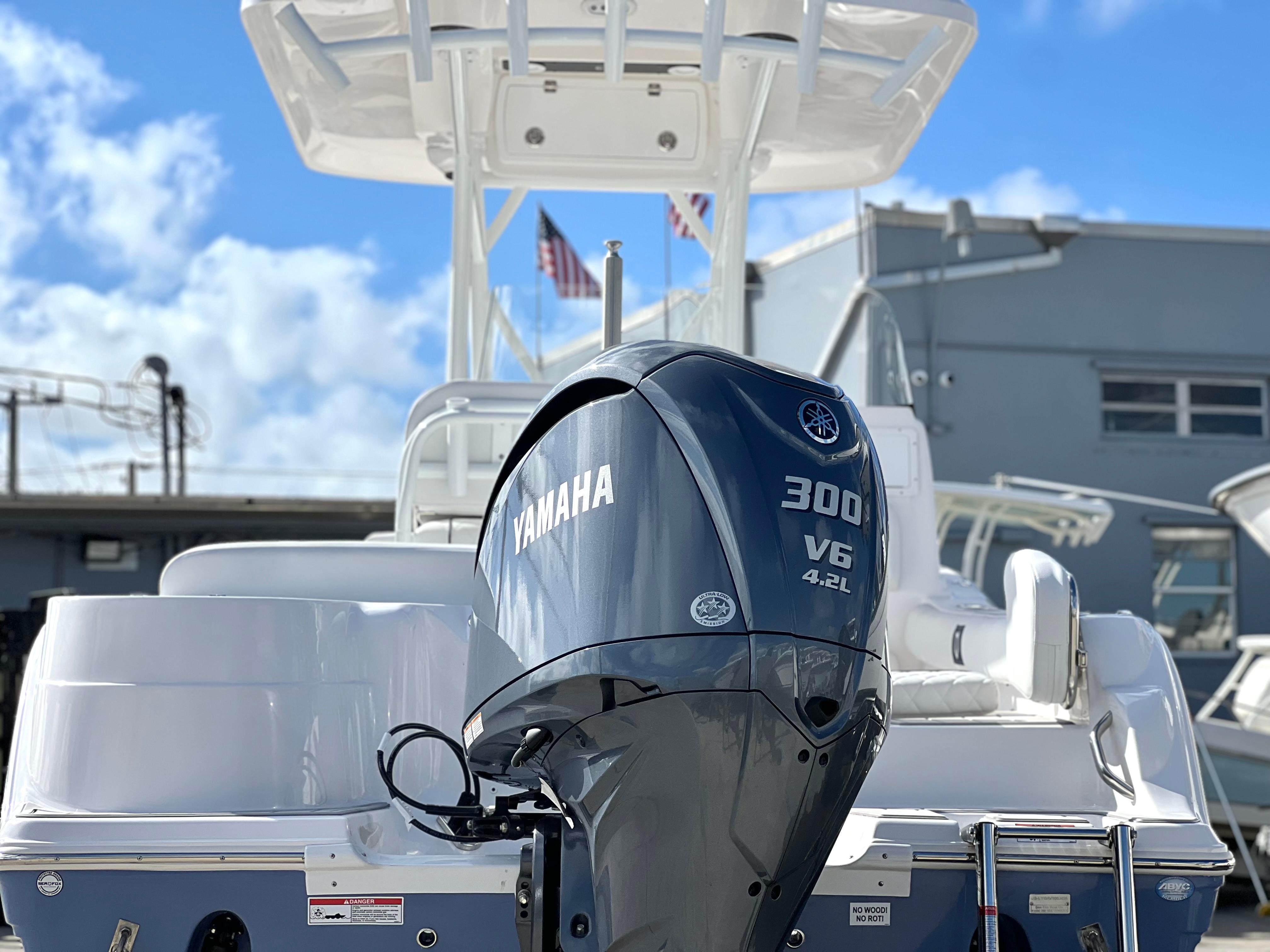 2025 Sea Fox 248 Side Console boat with Yamaha 300 V6 engine, docked under blue sky.