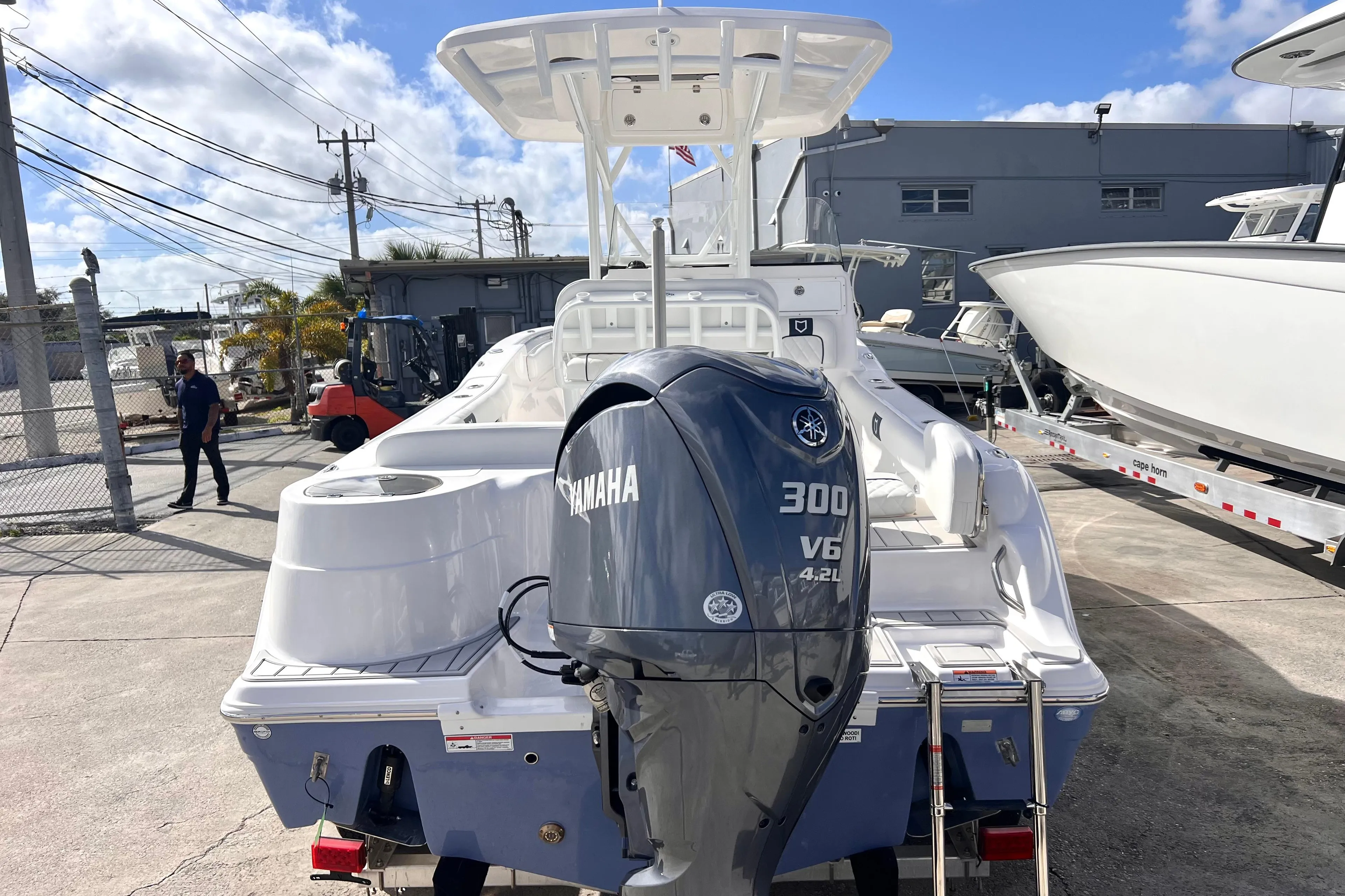2025 Sea Fox 248 Side Console boat with Yamaha 300 V6 engine, docked outdoors.