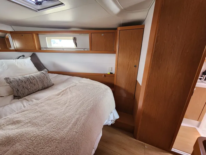 Jump Off Yacht Photos Pics Luxurious cabin interior of 2011 Beneteau Sense 50 yacht with cozy bedding.