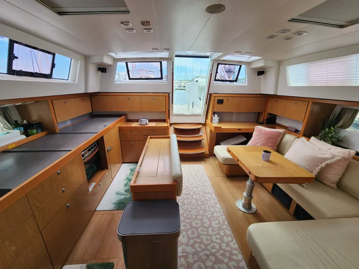 Jump Off Yacht Photos Pics Spacious interior of 2011 Beneteau Sense 50 yacht with modern furnishings and ample natural light.