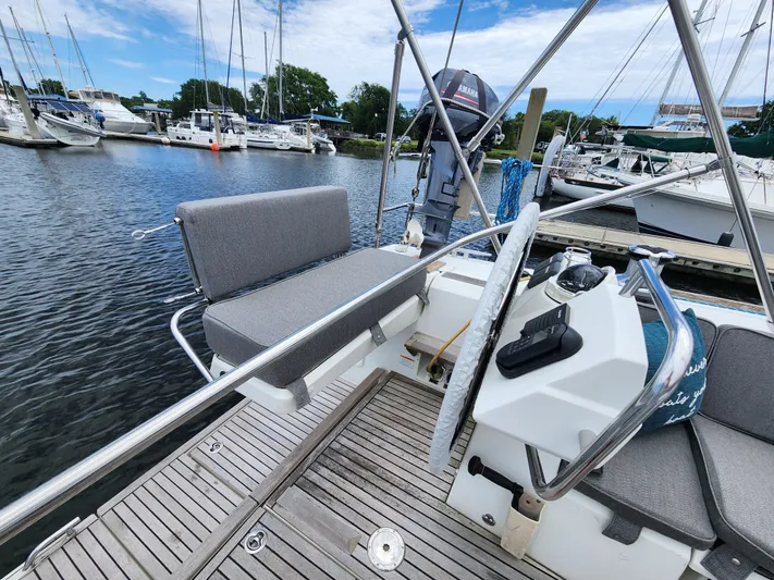 Jump Off Yacht Photos Pics Beneteau Sense 50 sailboat cockpit with steering wheel, docked in marina, 2011 model.
