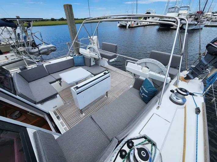 Jump Off Yacht Photos Pics 2011 Beneteau Sense 50 yacht with spacious deck and seating in marina.