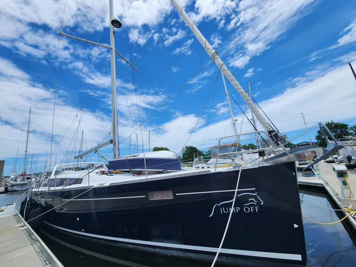 Jump Off Yacht Photos Pics 2011 Beneteau Sense 50 sailboat docked under a bright blue sky.
