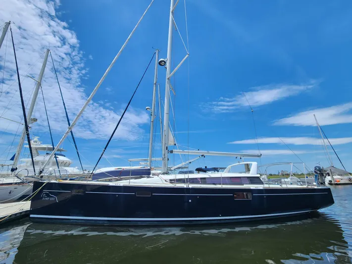 Jump Off Yacht Photos Pics 2011 Beneteau Sense 50 sailboat docked under a clear blue sky.