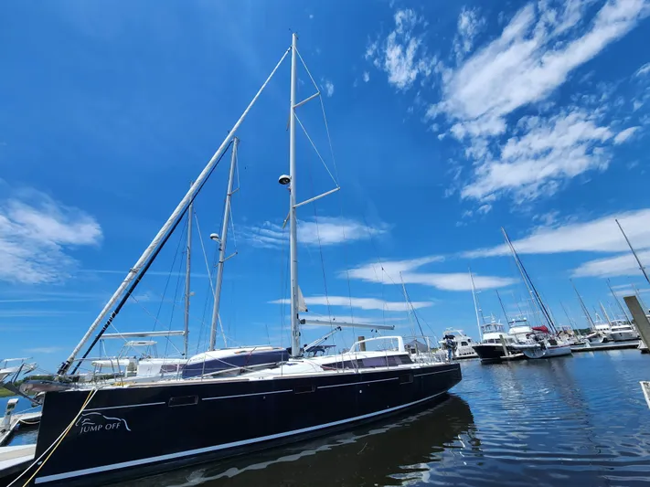Jump Off Yacht Photos Pics 2011 Beneteau Sense 50 sailboat docked under a clear blue sky.