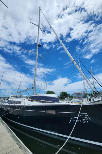 Jump Off Yacht Photos Pics 2011 Beneteau Sense 50 sailboat docked under a vibrant blue sky.