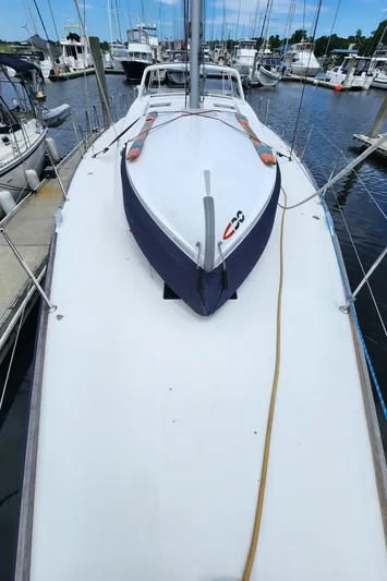 Jump Off Yacht Photos Pics 2011 Beneteau Sense 50 sailboat docked in marina, top deck view.