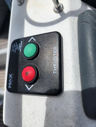 Jump Off Yacht Photos Pics Beneteau Sense 50 2011 thruster control panel with red and green buttons.