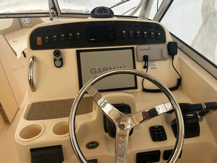  Yacht Photos Pics 2011 Grady-White 307 boat helm with Garmin navigation system.