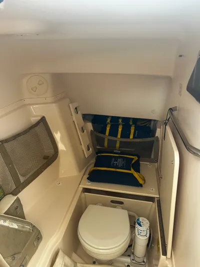  Yacht Photos Pics Interior of a 2011 Grady-White 307 yacht with toilet and storage.